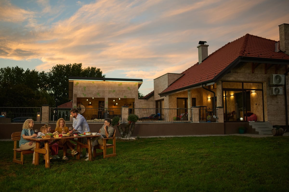 Family enjoying dinner together at home in the evening
