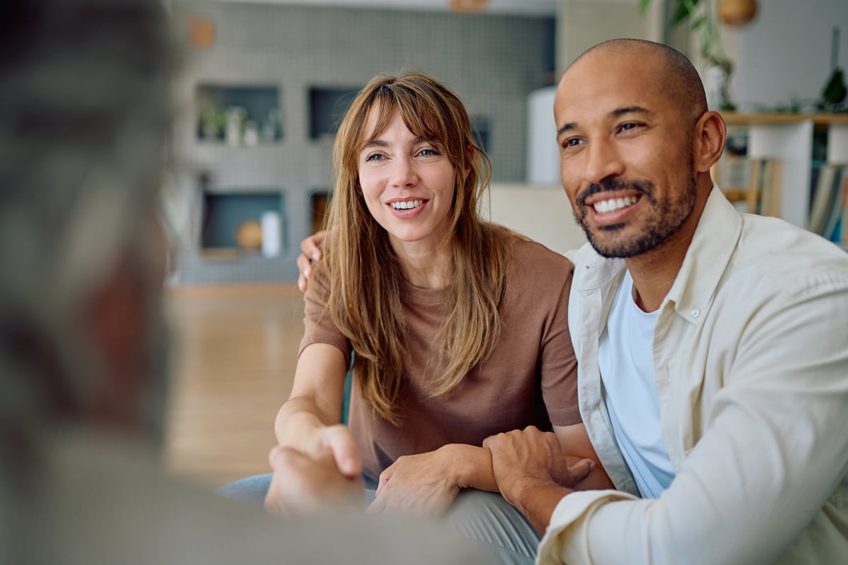 Consultant and client shaking hands after a planning meeting